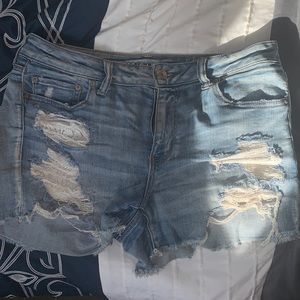 American eagle next level stretch blue jean shorts with front lace pockets.